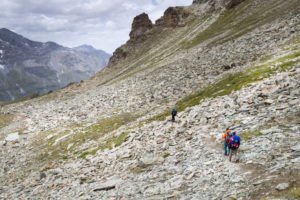 Mountaineer descending from the Tracuit hut, weak and exhausted Mountaineer descending from the Tracuit hut, weak and exhausted